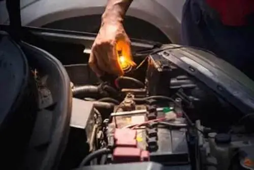 A Flashing Test-Lamp While Checking Car Fuse