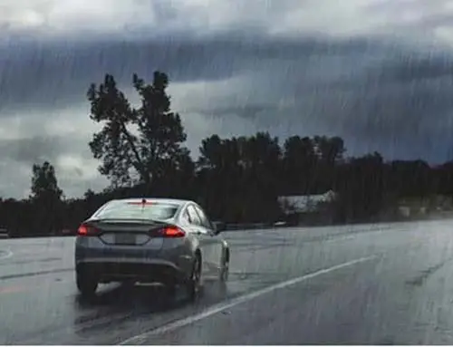 Car Moving In The Rain